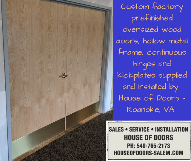 Custom factory prefinished oversized wood doors, hollow metal frame, continuous hinges and kickplates supplied and installed by  House of Doors - Roanoke, VA 