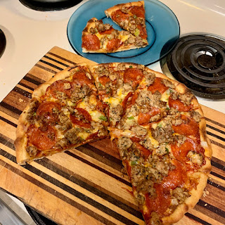 Pizza sliced after baking