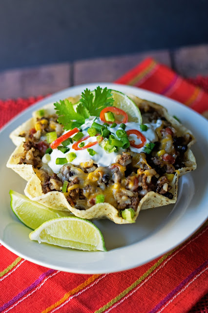 The Mexican Fried Rice in a  tortilla bowl with toppings.