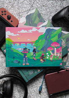 A physical book of .dungeon lies on top of gaming paraphernalia (headphones, a Nintendo Switch, an Xbox controller). The cover itself has bright pinks and greens and shows several MMORPG characters with level bars above their heads conversing with several very short individuals