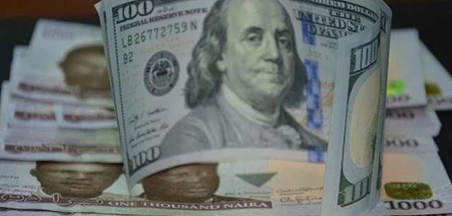 Alt: = "Naira and dollar notes"