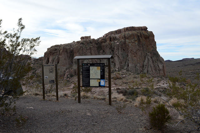 signs and a monolith