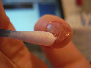 Fixing smudged or chipped nail polish with a qtip