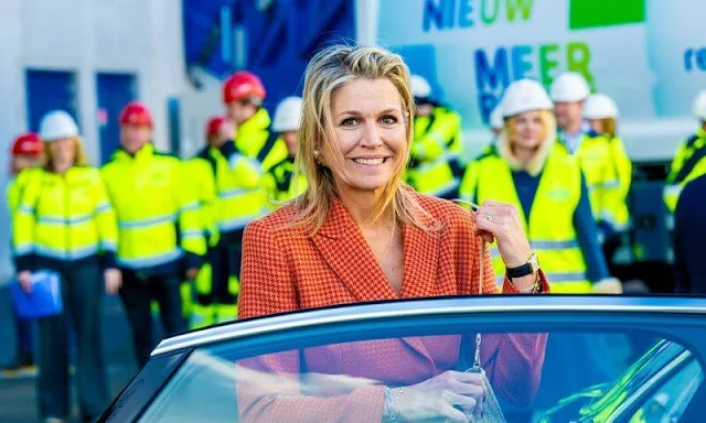 Queen Maxima wore an orange plaid belted blazer jacket suit by Natan. Natan trousers. Grisport