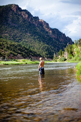 a man stands in the Colorado River