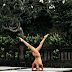 Woman Peacefully Sharing Yoga Poses Naked