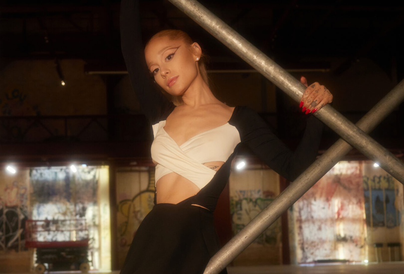 A shot of Ariana Grande in a photoshoot on the set of her music video for “Yes, And?”.