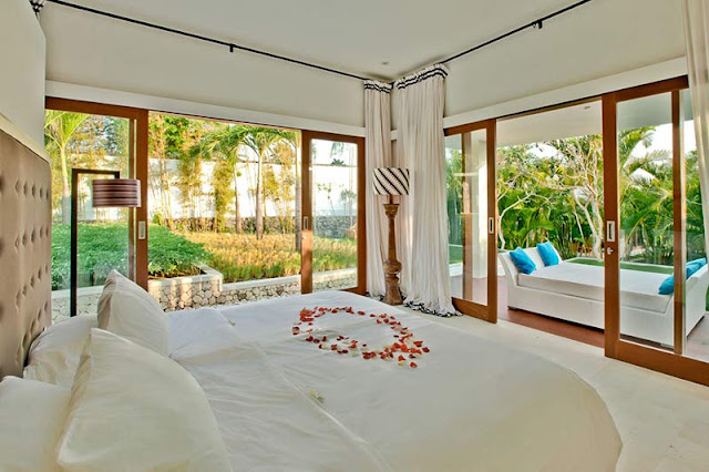 Picture of modern bedroom surrounded by vegetation