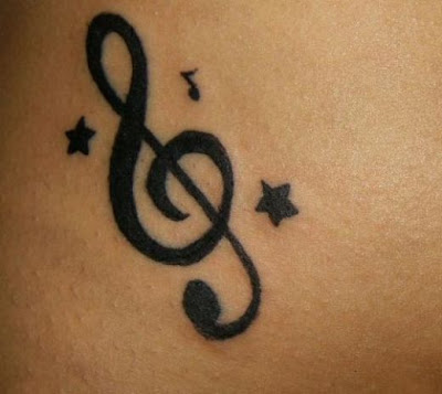 musical tattoo designs. music tattoo designs