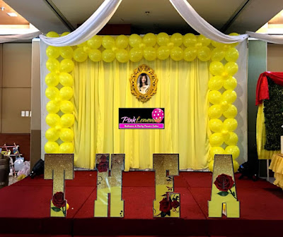 Belle inspired stage decor and name standee