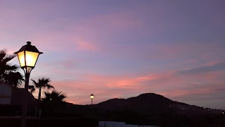 the sky turning pink at sunset out of my window