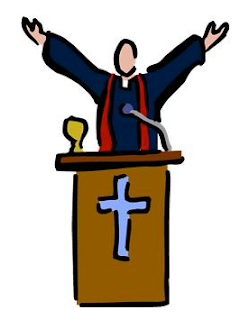 pastor behind pulpit with arms raised