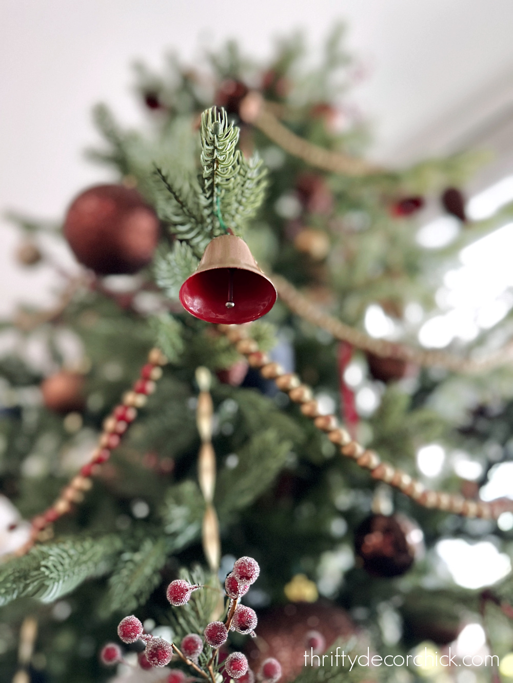 red and gold bells on tree