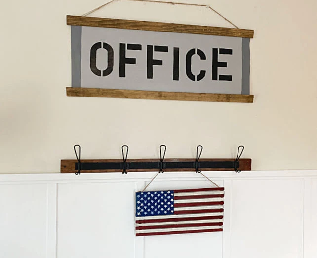 office sign and American flag on hooks