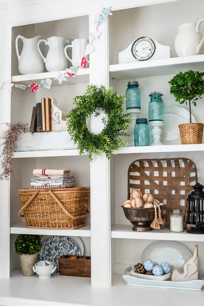 built ins, tobacco basket, white ironstone pitchers, greenery