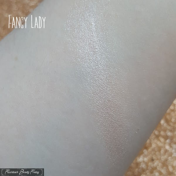 swatch of BeneFit Fancy Lady Cheek and Lip Highlighter on pale skin