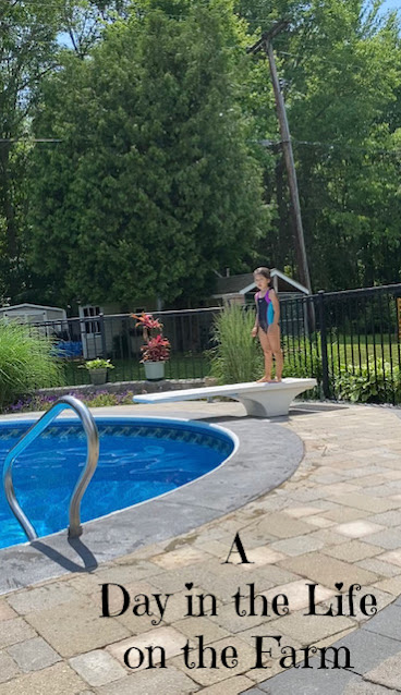 girl on diving board at pool