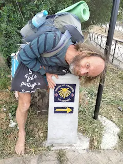 I touch a stony beautiful sign post of the "Via Serrana"