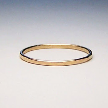Recently I've seen a few women wearing simple gold wedding rings by 