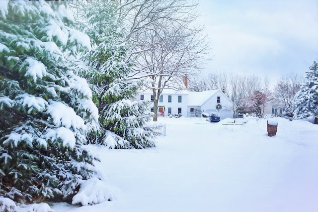 A serene home covered in snow.