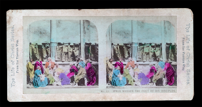 A hand-colored stereograph shows Jesus washing the disciples' feet.