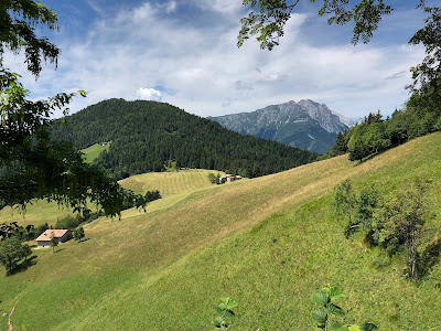 Leaving the mountains and coming into farmland above Valzurio.