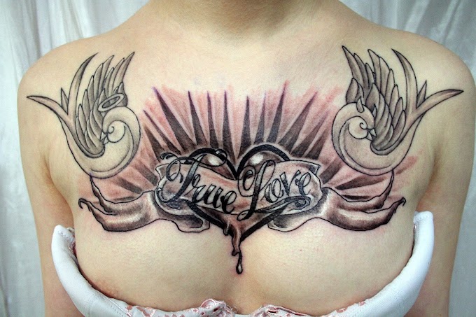 Girl with black heart tattoo on her chest