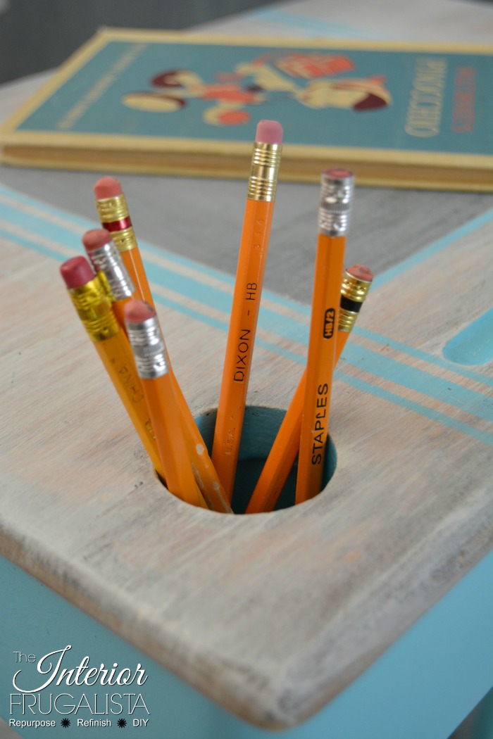 How to upcycle a vintage metal and wood classroom desk with bright turquoise paint and a whitewash finish plus a DIY chalkboard top writing slate.