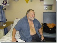 Dave on his bed in hospital.