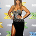 Gotta have it or make it stop? Kelly Rowland in thigh high split