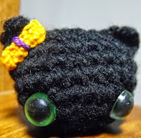 http://www.ravelry.com/patterns/library/tiny-black-cat-2