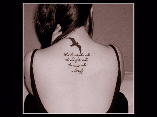 Dove Tattoo On The Back Of A Woman With Meaningful Words
