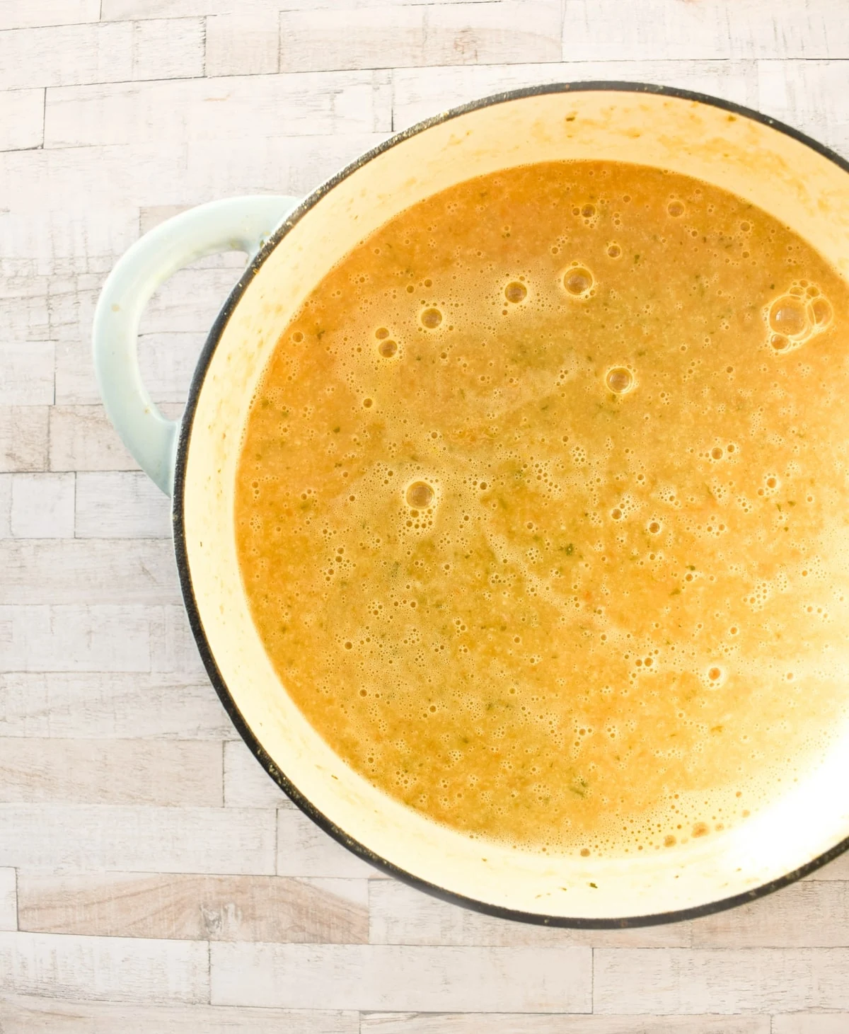 Cauliflower soup (blended smooth) in a pot.