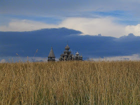 Picture of a wheat field with Russian Orthodox church in background