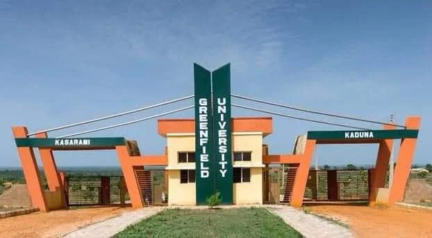 Alt: = "Photo showing greenfield University, kaduna gate"