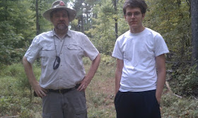 A photo of interviewee J Keller and his son, co-creator Jason Keller, standing outside during a geocaching excursion.