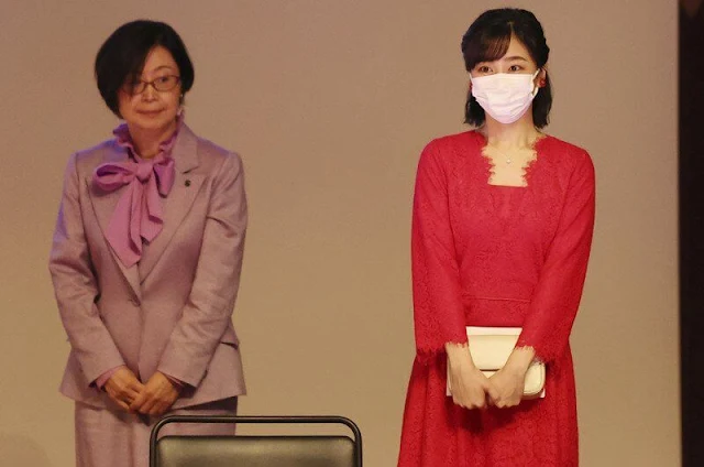 Princess Kako wore a red lace midi dress and red top. Red flower and pearl earrings