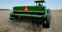 Seeder on farm field (Credit: AP Photo/J.D. Pooley, File) Click to Enlarge.