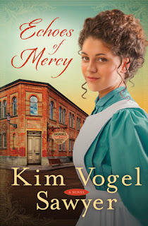 cover of Echoes of Mercy by Kim Vogel Sawyer shows a brunette wearing an aqua dress covered by a white apron in front of a corner store