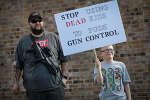 White men armed with guns and sidearms counter protesters during #MarchForOurLives rallies at different locations across the country. They dubbed theirs #MarchForOurGuns. Some shouting "March For Our Guns" into cameras.  Oddly, there presence since to come and go without violence besides the chants from both faction.  See more 'brazen' photos after the cut