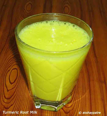 fresh turmeric root milk in a serving glass