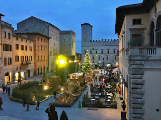 Skating rink set up at Christmas time in Piazza del Popolo, Gubbio, Umbria, Italy