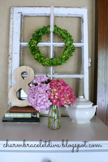 pink hydrangeas in vintage milk bottle