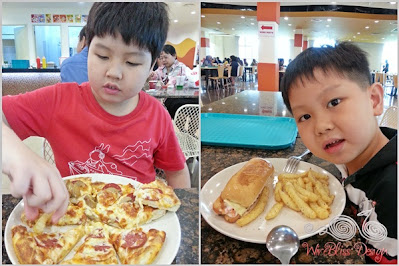 Boys having pizza and chips for lunch
