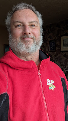 Mike Riversdale selfie wearing a red Welsh Rugby Union fleece top