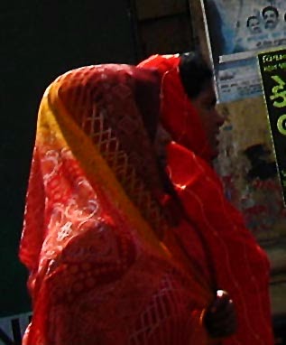 Close up of women with saris pallav covering their heads