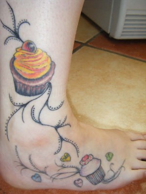 Cupcake ankle and foot tattoo.