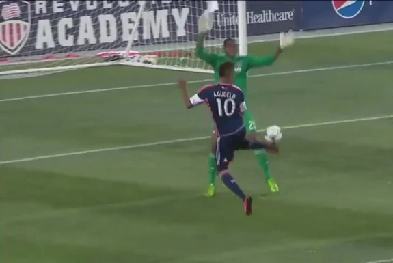 New England Revolution player Juan Agudelo flicks the ball to score against Chicago Fire