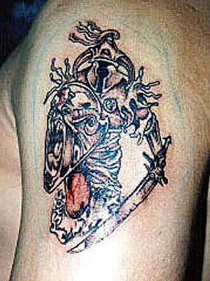japanese samurai tattoo on upper arm. at 7:45 AM