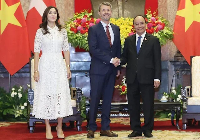 Crown Princess Mary wore a Berry white lace neck-tie dress by Temperley London. Prada pointed toe beige leather pumps